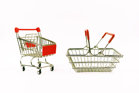 Shopping concept. Shopping cart, grocery trolley, food basket, side viewの写真素材