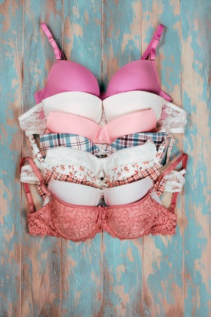 Set of different bras on wooden backgroundの写真素材