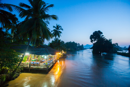 Riverside restaurant near Mekong River in twilight. Don Det-Don Khon Island. Champasak Province, Laos.のeditorial素材