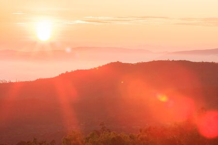 Golden sunrise shines down around the mountain. Doi Inthanon National Park in winter season, the highest mountain in Thailand. Chom Thong District. Chiang Mai Province, Northern Thailand.の写真素材