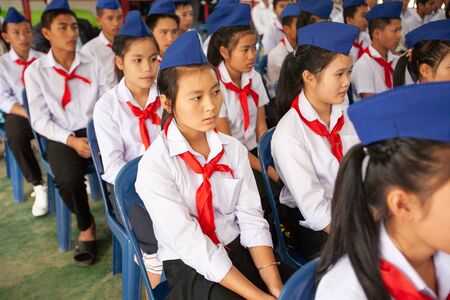 Vientiane, Laos PDR %u2013 JANUARY 13, 2010: High school students during class. Red scarf and blue beret are symbol of Lao People%u2019s Revolutionary Youth Union. Vientiane.のeditorial素材