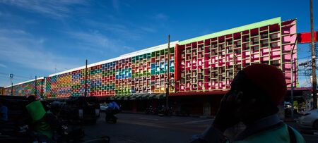 Multi-colored facade of shop houses in the old town of Yala, South Thailand.