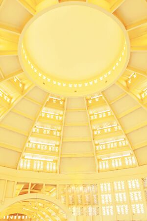 Classical elegant interior of Phsar Thmei or the central market, the dark-yellow Art Deco building is shape in the form of a nice central dome. Phnom Penh, Cambodia. The market is open to the public.の写真素材
