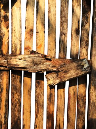 Abandoned broken wooden fence isolated on white backgroundの写真素材