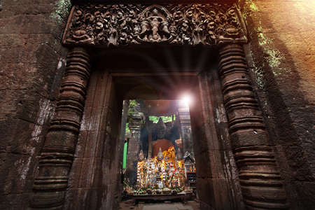Picturesque facade of ancient sanctuary at Vat Phou, South Laos, rich-carved sandstone of lintel. Focus on lintel.のeditorial素材