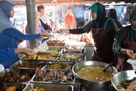Narathiwat, Thailand - JULY 13, 2019: Local Thai-Malay food selling at a wet market. Focus on...