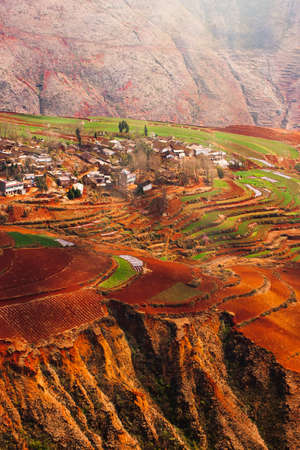 The scenery of mountains terraces views or Dongchuan Red Land, an ancient village surrounded by colorful soil terracing. Tourist attractions in China.の写真素材