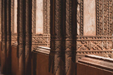 Elegant stucco decorations of the columns and terrace of the ancient Buddhist temple in Haw Phra...