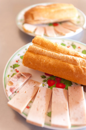 Close-up of Baguette or French bread with Vietnamese pork sausages serves on plates at a local restaurant in Koh Kong Province, Cambodia. Cambodia style.の写真素材