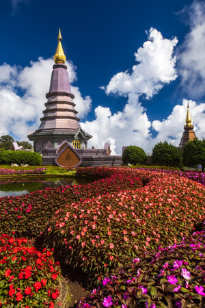 The landscape of two pagodas or chedis and flower gardens near the summit of Doi Inthanon mountain in the rainy season. Chiang Mai, Thailand.の写真素材