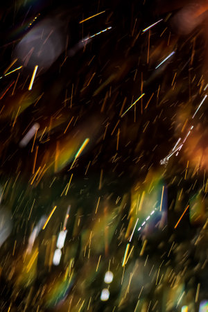 Close-up of freshwater splashing in sunlight with a vibrant rainbow. Abstract, background, surface.の写真素材