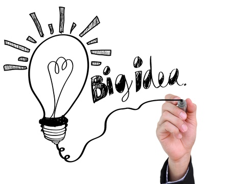 Businessman drawing light bulb with big idea isolated on white backgroundの写真素材