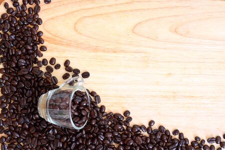 bean coffee cup on wooden table backgroundの写真素材