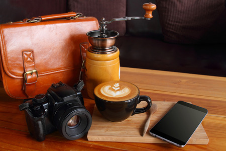 bag,telephone, phone,camera,vintage brown coffee and coffee grinder on gold wooden.の写真素材
