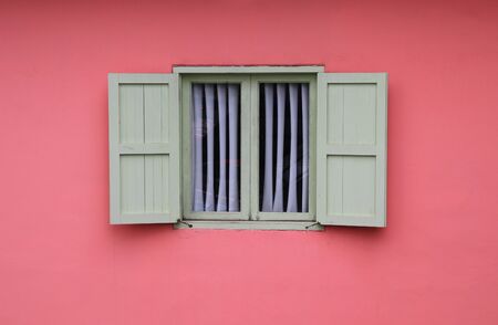 Vintage window on pink wall background retro styleの写真素材