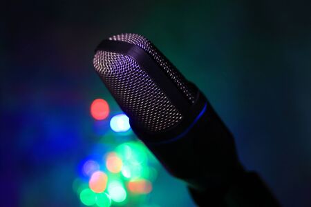 Close up of microphone for live with colorful bokeh backgroundの写真素材