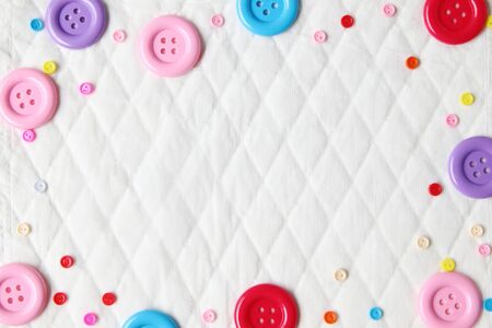 Diamond pattern paper texture with colorful buttons placed around.Blank of white pattern paper for place productsの写真素材