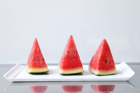 Watermelon placed in a food tray isolated on white background. Blank with white space For entering text.の写真素材