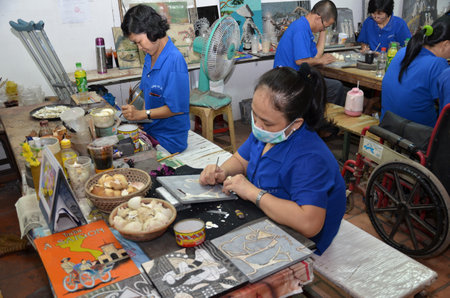 Worker works on hand craft in Vietnam factoryのeditorial素材