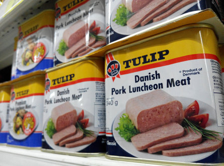 Tulip luncheon meat cans are being sold in the supermarket in Singapore のeditorial素材