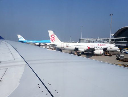 Hong Kong- NOV 19: A Dragonair airplane is station in the Hong Kong airport on November 19, 2014 in Hong Kong. The headquarter of Dragonair is located in Hong Kong.のeditorial素材
