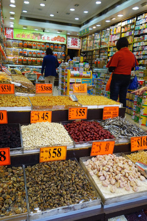 HONG KONG - NOVEMBER 23: Shoppers visit the dry food shops on November 23, 2014 in Hong Kong. Hong Kong is famous for selling seafood since the 19 century.のeditorial素材