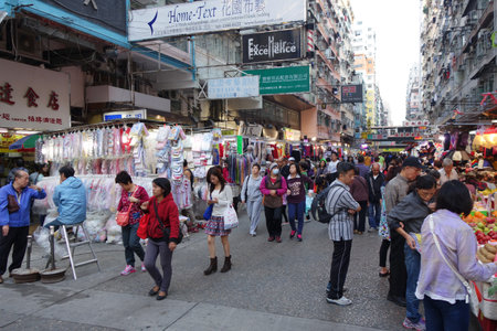 HONG KONG - NOVEMBER 22 :Tourist shops for bargain priced fashion and casual wear in Mong Kong market on 22 November 2014. The market is famous with many booths selling local products.のeditorial素材
