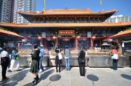 HONG KONG - NOVEMBER 22, 2014 - Hong Kong people visit the Wong Tai Sin Buddhist Temple to pray on November 22, 2014, in Hong Kong. Wong Tai Sin Temple is very famous tourist spot in Hong Kong.のeditorial素材