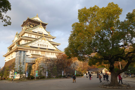 OSAKA, JAPAN - DECEMBER 04 2014: Tourists visit Osaka Castle in Japan on December 04, 2014. Osaka Castle was first built in 1583 on the former site of the Ishiyama Honganji Temple.のeditorial素材
