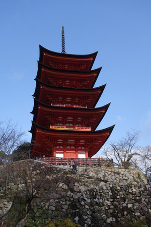 MIYAJIMA, JAPAN - DECEMBER 12: Tourists visit Miyajima pagoda on December 12, 2014 in Miyajima, Japan. Miyajima is a shinto holy site and listed in the World heritage of UNESCO.のeditorial素材