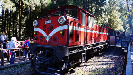 ALISHAN, TAIWAN-NOV 23:Tourists take a ride on Alishan Mountain train on November 23, 2014. Riding...