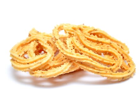 Traditional indian snack - chakali, isolated on white.の写真素材