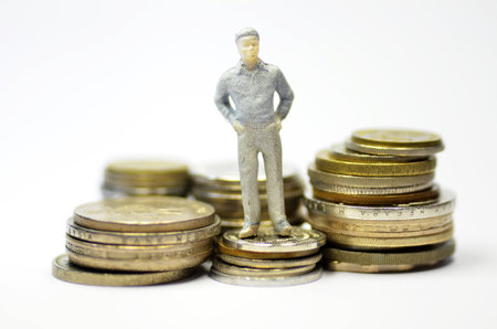 Miniature people with coins. Business and finance conceptのeditorial素材