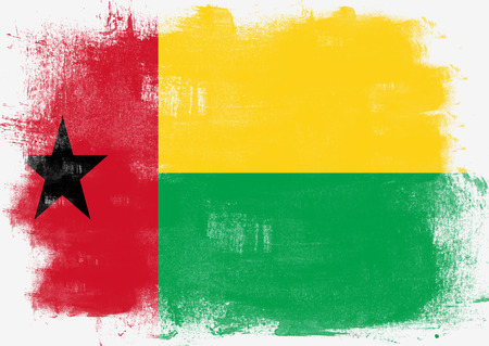 Flag of Guinea Bissau painted with brush on solid background,の写真素材