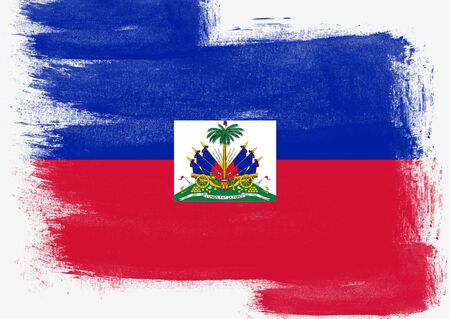 Flag of Haiti painted with brush on solid background,の写真素材