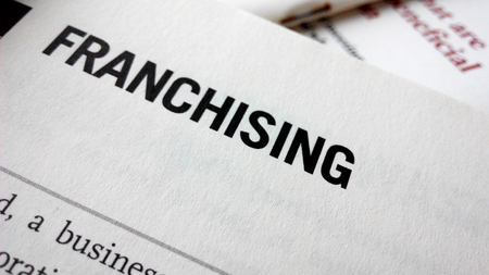 Franchising word on a book. Business success conceptの写真素材