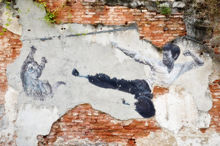 PENANG, MALAYSIA - NOV 26, 2015: Painting of a street mural painting 'The Real Bruce Lee Would Never Do This' painted by 101 Lost Kittens in Penangのeditorial素材
