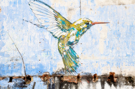 IPOH, MALAYSIA- 23 NOV, 2015: "Hummingbird" wall art painted by famous artist, Ernest Zacharevic in Ipoh.The mural depicts a hummingbird hovering close by a tree in search of foodのeditorial素材