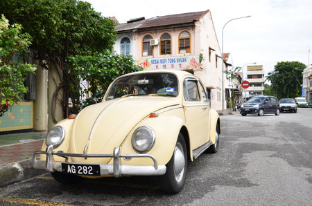 IPOH, MALAYSIA - 24 NOV, 2015: Classic VW Beetle parked on the roadside of Ipoh town, Malaysia. Ipoh is one of historical town in Malaysia.のeditorial素材
