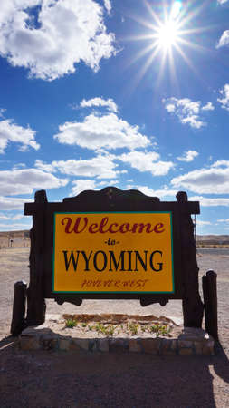 Welcome to Wyoming road sign with blue skyの写真素材