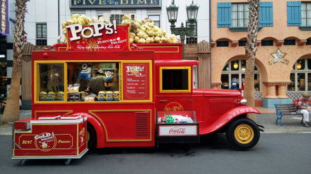 SINGAPORE, JUN 04, 2016: Red truck that selling porncorn at Universal Studios. Universal Studios Singapore is theme park located within Resorts World Sentosa, Singapore.のeditorial素材