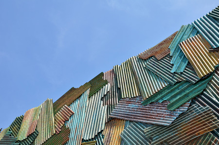 Grunde zinc fence with blue sky backgroundの写真素材