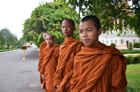 PHNOM PENH, CAMBODIA - OCT 22, 2016: Monks tour the Royal Palace grounds in Phnom Penh, Cambodiaのeditorial素材