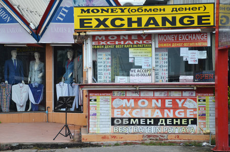 PATTAYA, THAILAND - 22 NOV, 2016: Money exchange shop on the corner of a street in Pattaya, Thailand.のeditorial素材