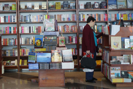 PHNOM PENH, CAMBODIA- 21 OCT, 2016: Customer shops for books in Phnom Penh Airport, Cambodia.のeditorial素材