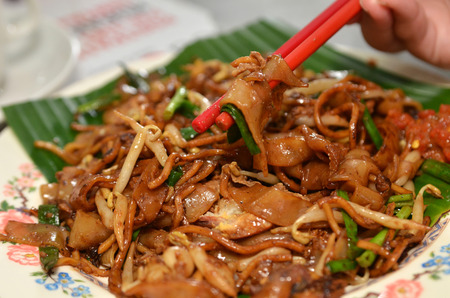 Fried Penang Char Kuey Teow which is a popular noodle dish in Malaysiaの写真素材
