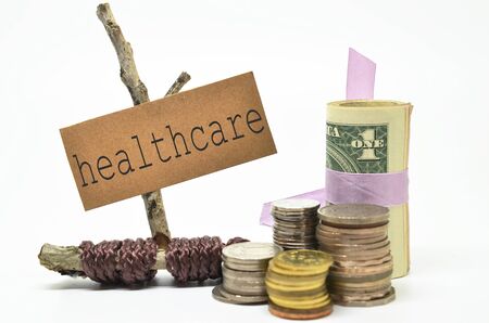Coins and money with healthcare label. Financial concept. の写真素材