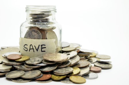 Calculator and coins isolate on whitebackgroundの写真素材