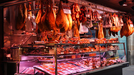 BARCELONA,SPAIN-FEB 18,2017: Meat store at La Boqueria market, next to Les Rambles in Barcelona,...