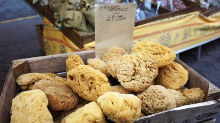 Baskets with natural marine sponges exposed in a street marketの写真素材
